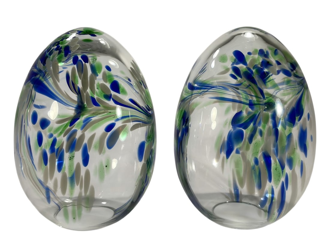 Pair of Handblown Art Glass Egg Form Globe Shades: Pair of handblown art glass globe shades in egg form, clear glass with internal blue, green, and white pulled feather decoration in an organic swirl. Open base, suitable for pendant or lamp use, with