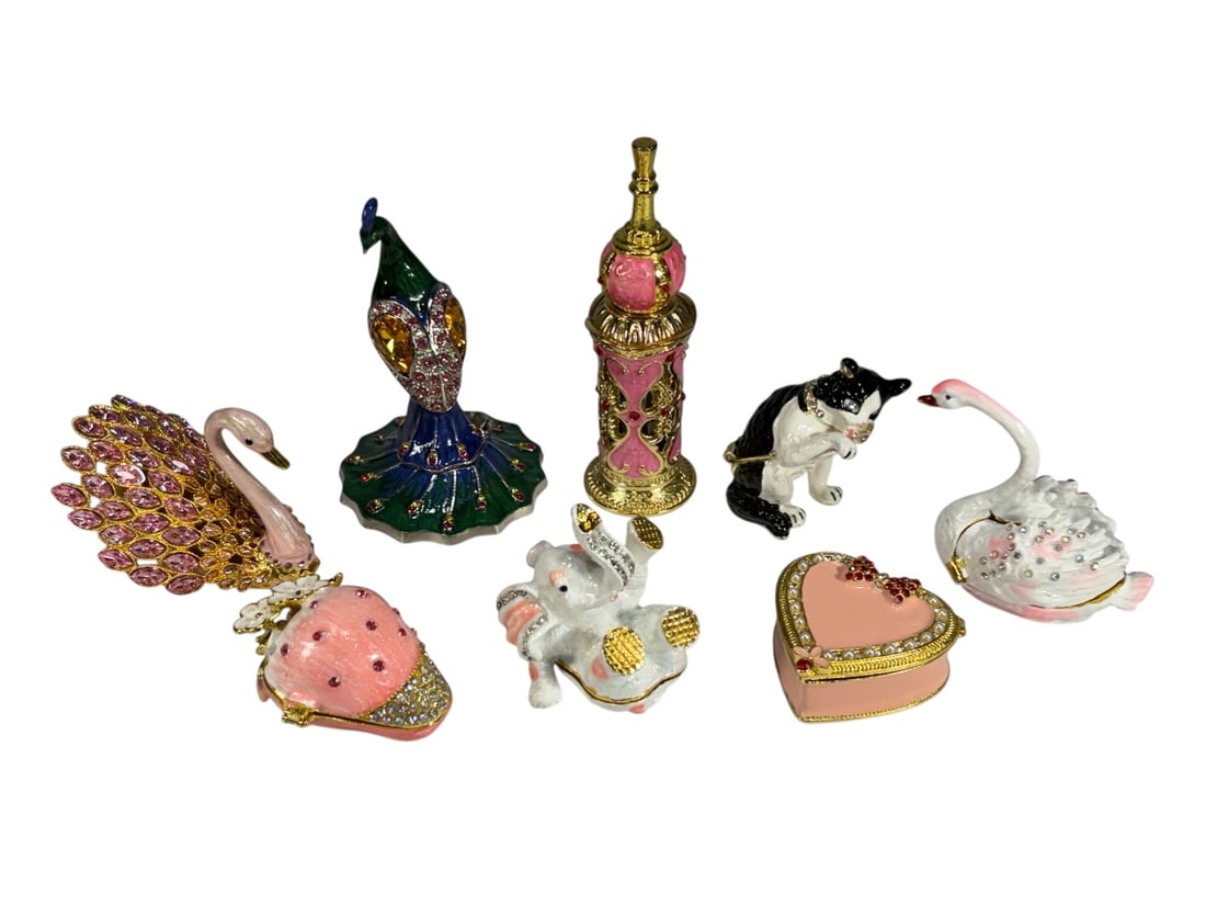 Decor Enameled Metal & Crystal Trinket Boxes 8pcs: Group of eight enameled metal trinket boxes with crystal accents, including figural designs such as swans, peacock, elephant, cat, strawberry, heart, and perfume bottle. The largest measures approxima