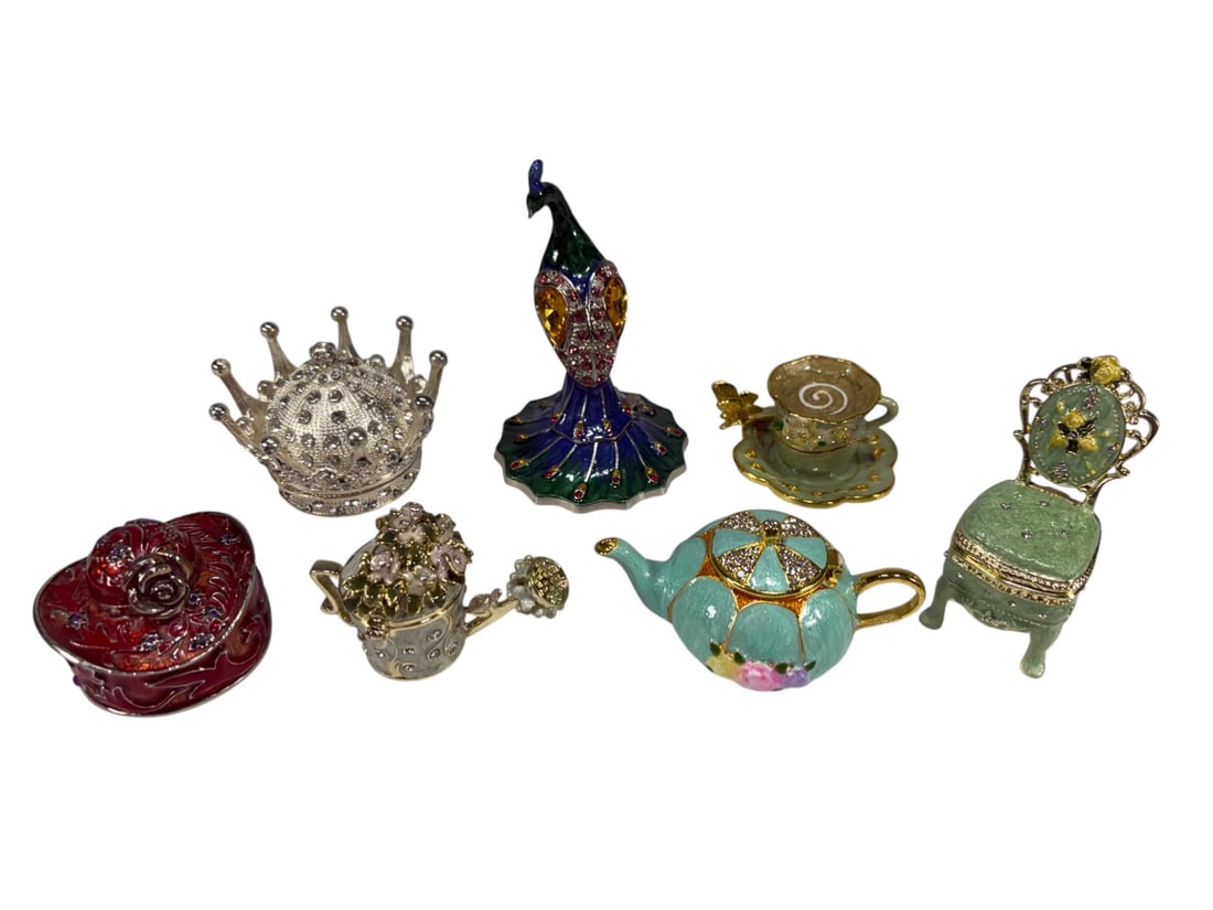 Decor Enameled Metal & Crystal Trinket Boxes 7pcs: Collection of seven enameled metal miniature trinket boxes with crystal accents, including peacock, crown, teapot, watering can, hat, teacup and saucer, and chair forms. The largest measures approxima