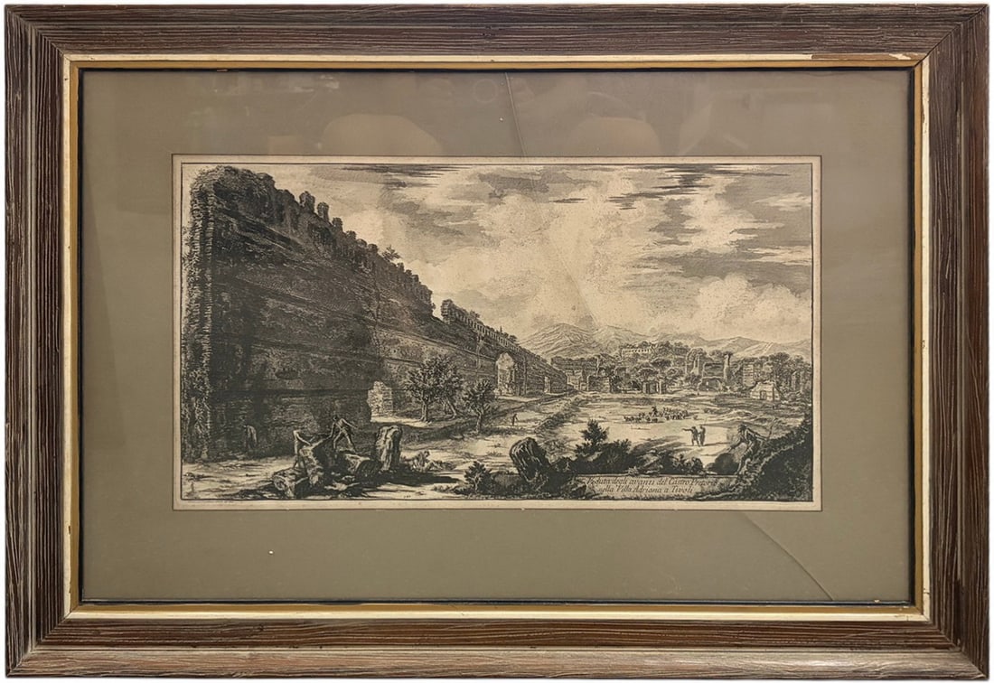 Giovanni Battista Piranesi, Italian Engraving 28": Giovanni Battista Piranesi (Italian, 1720 - 1778) titled View of the Remains of the Praetorian Fort (The Proecile), Hadrians Villa, Tivoli. Architectural etching depicting expansive Roman ruins with m