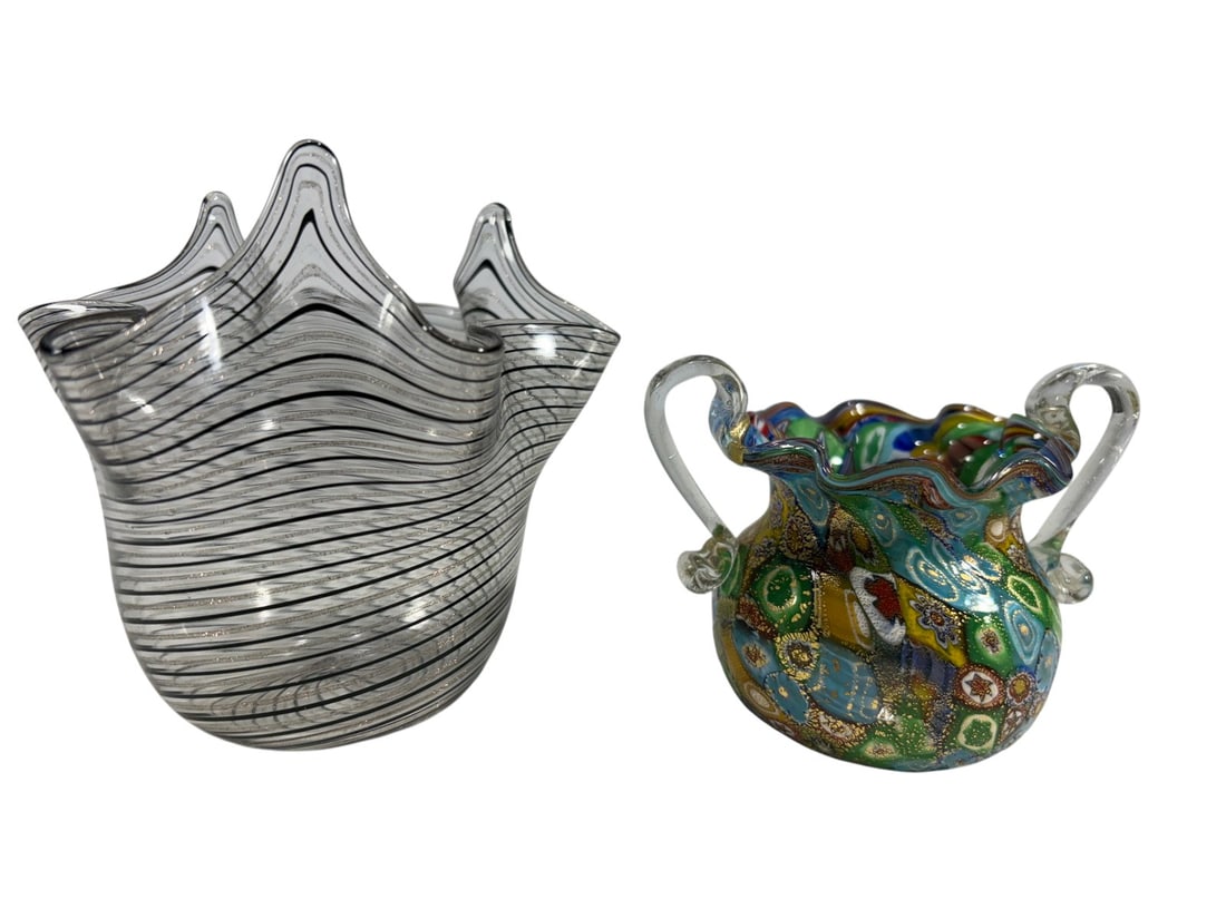 Millefiori Handle & Handkerchief Glass vases 2pcs: Two art glass vases: a multicolor millefiori handled vase with gold aventurine and ruffled rim, and a clear-and-black striped handkerchief vase with wavy folded rim. The largest measures