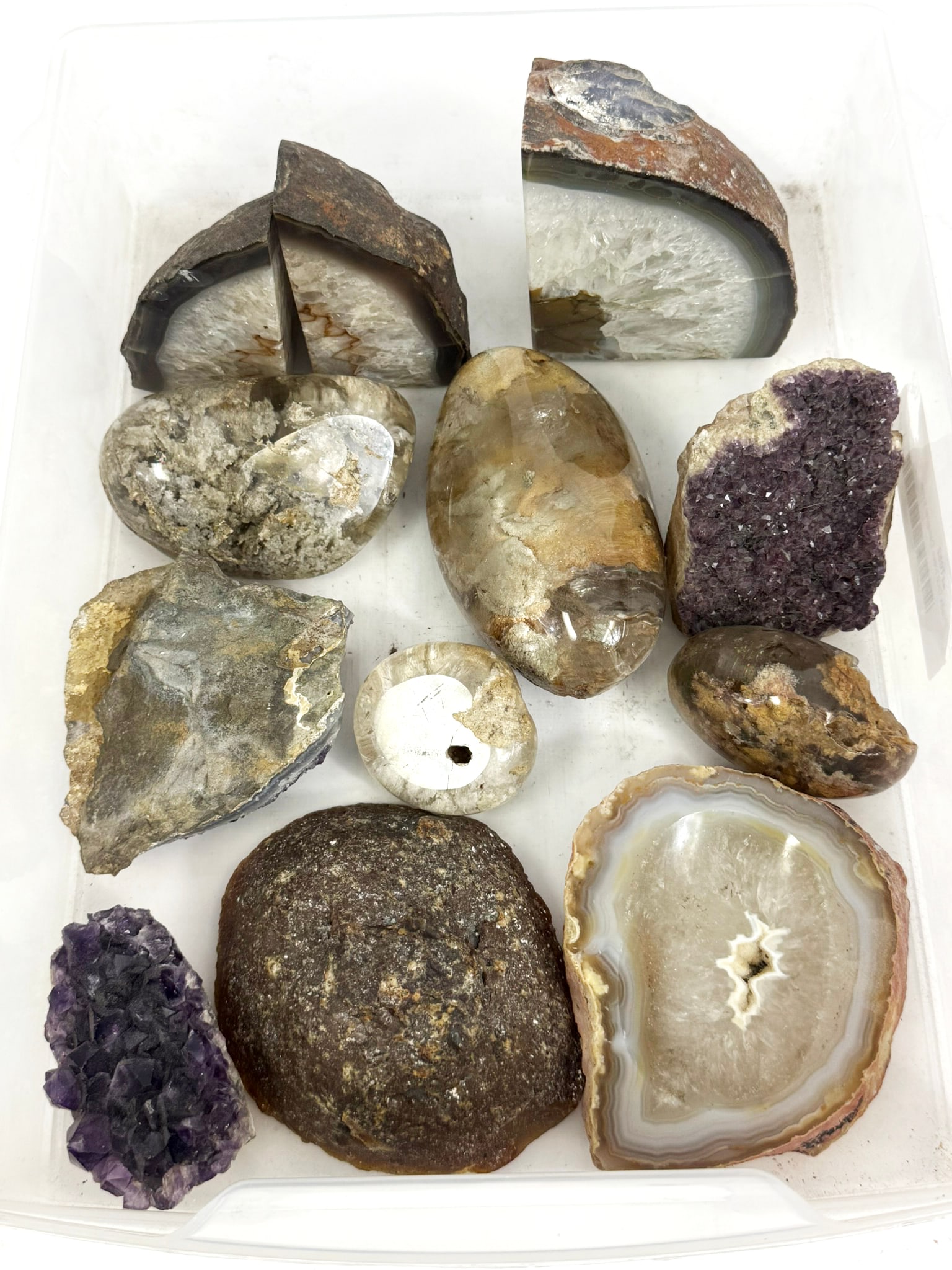 Mixed Mineral & Geode Specimens 12pc COLLECTION: Mixed lot of twelve mineral specimens including agate geode halves, polished stone specimens, and amethyst crystal clusters. The group features banded agate, druzy quartz interiors, and natural minera
