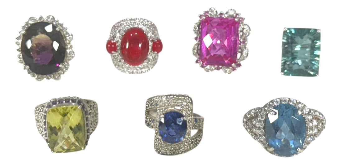 Sterling Silver Gem-Set Cocktail Rings 7pc LOT: Lot of seven sterling silver statement rings, each showcasing a large, colorful center stone in a variety of cuts and hues, surrounded by pave-set clear crystals or accent stones. The collection inclu