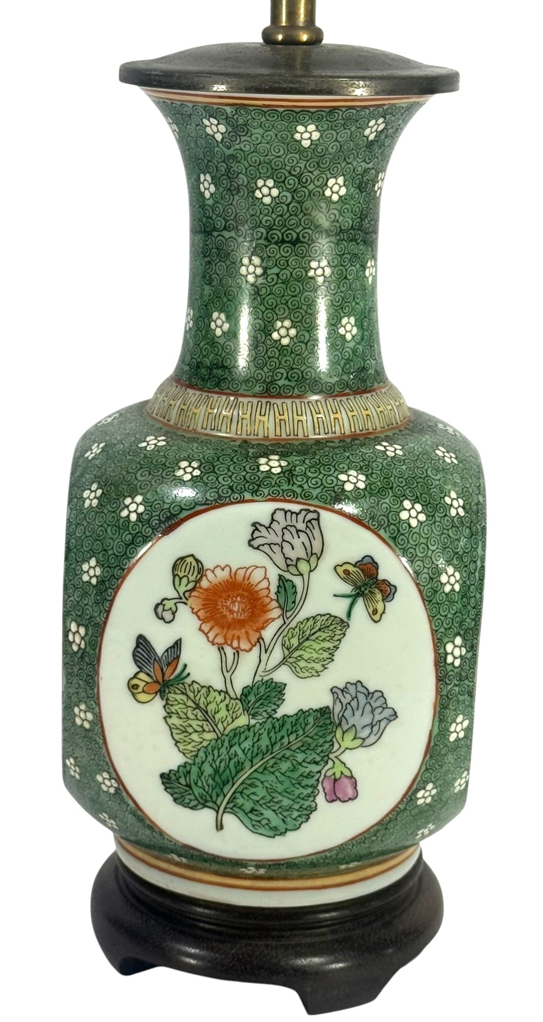 Maitland Smith Porcelain Table Lamp From Hong Kong: Maitland Smith Ltd, porcelain table lamp designed in a Chinese style using Famille palette colors with floral and butterfly decoration on a green patterned ground. Mounted on a carved wood base with b
