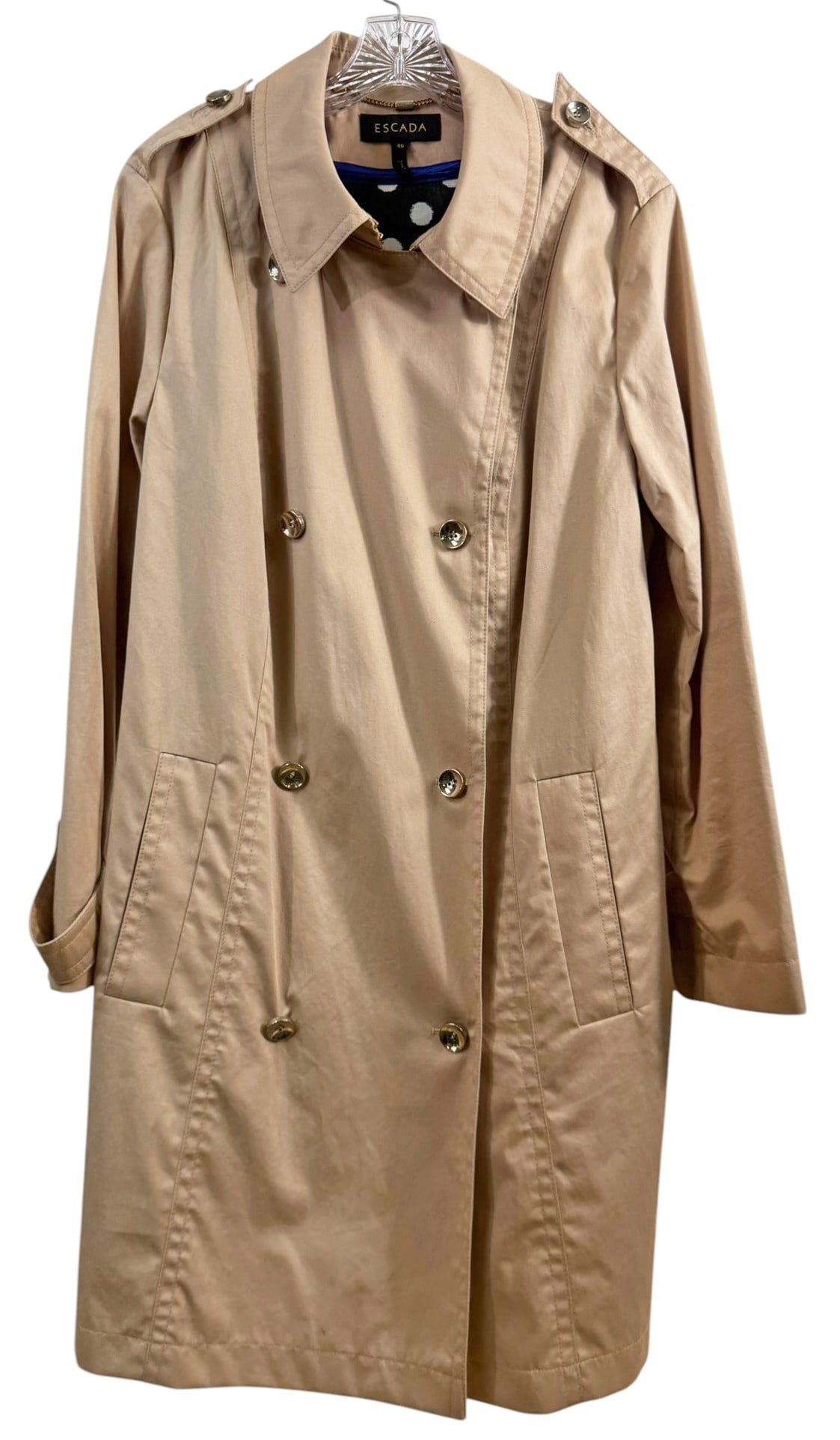 Escada Belted Trench Style Beige Jacket Size 46: Escada, cotton blend belted trench style jacket in sandgold with wide lapels and button front closure. Labeled size 46 and made in Croatia with contrasting polka dot interior lining. Features shoulder