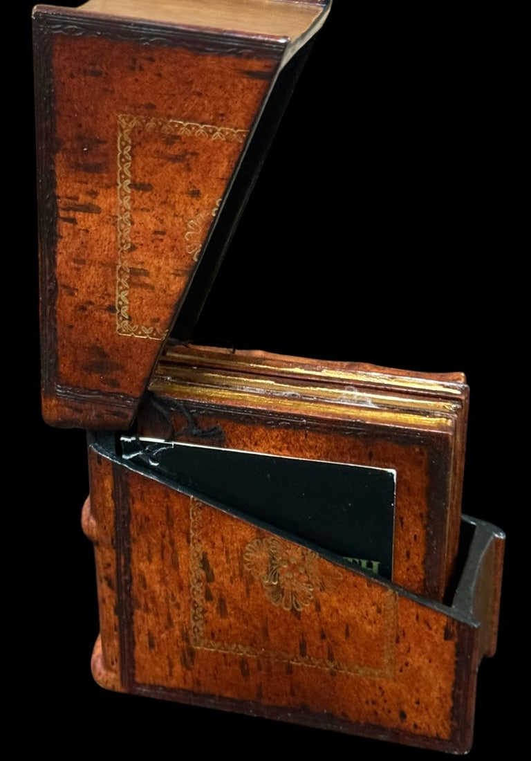 Maitland Smith Leather Case Inset Coasters 4pc SET: Maitland Smith, set of four decorative coasters featuring leather wrapped bodies with gilt tooled foliate decoration. The coasters store within a matching leather case with angled opening and gilt bor