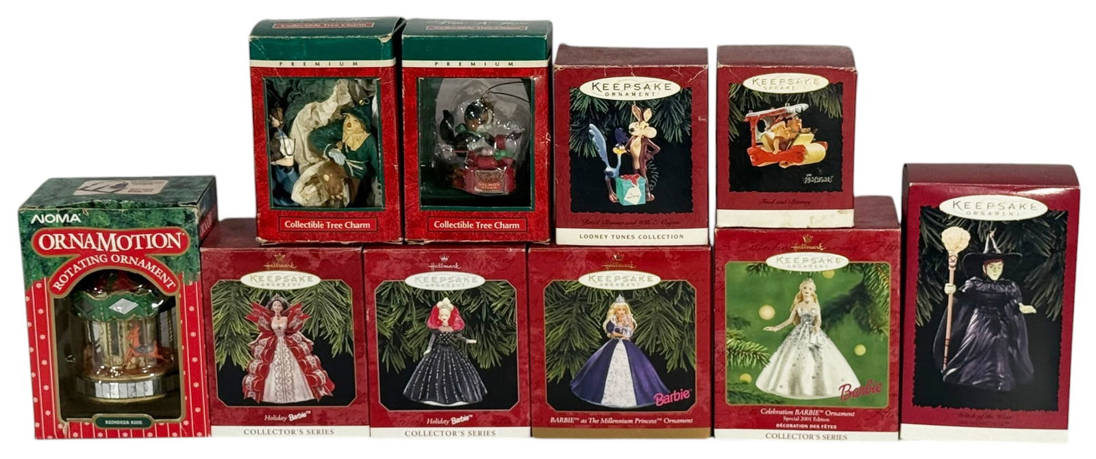 Hallmark Keepsake Christmas Ornaments 24pc LOT: Lot of twenty four Hallmark Keepsake Christmas ornaments, each presented in original boxes. The assortment includes various themed ornaments such as Superman, Wizard of Oz characters, Holiday Barbie,