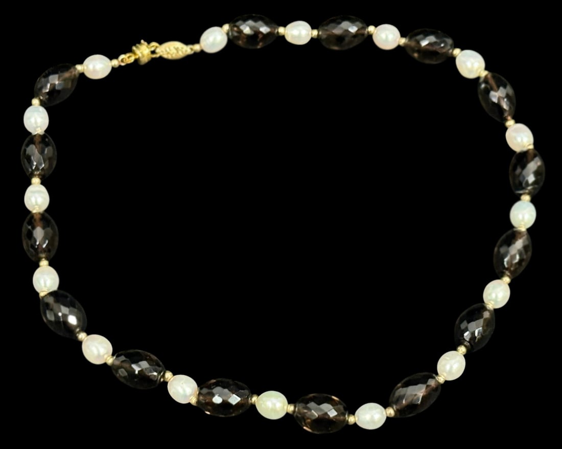Smoky Quartz and Freshwater Pearl Beaded Necklace: Necklace featuring alternating faceted smoky quartz beads and oval freshwater pearls with small gold-tone spacer beads. The stones are arranged in a repeating pattern creating a balanced two-tone