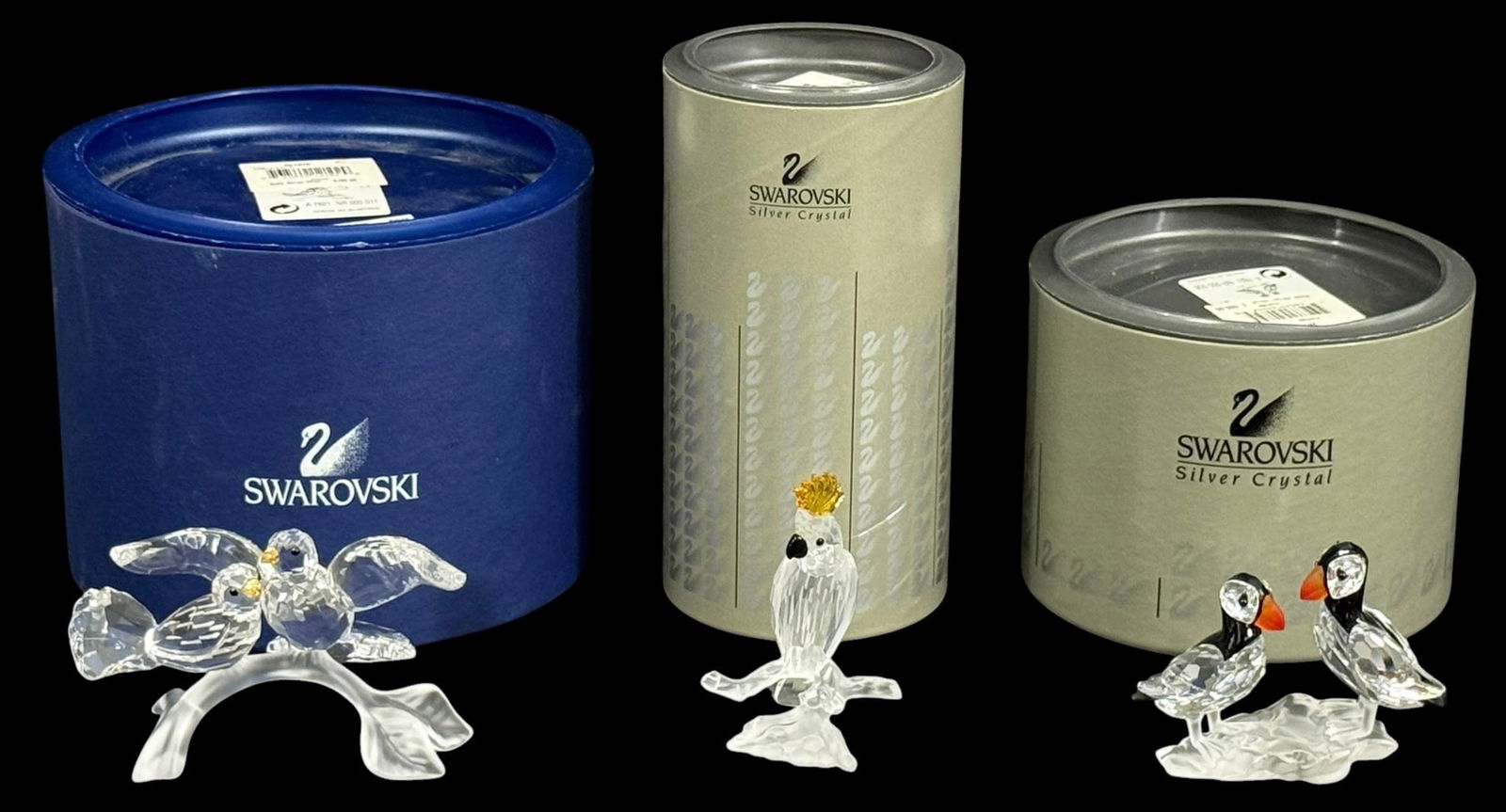 Swarovski Crystal Bird Figurines w/ Boxes 3pc LOT: Swarovski crystal figurines including turtle doves, a cockatoo, and puffins. Each figure features clear faceted crystal with colored accents and stands on a crystal base. The lot includes original
