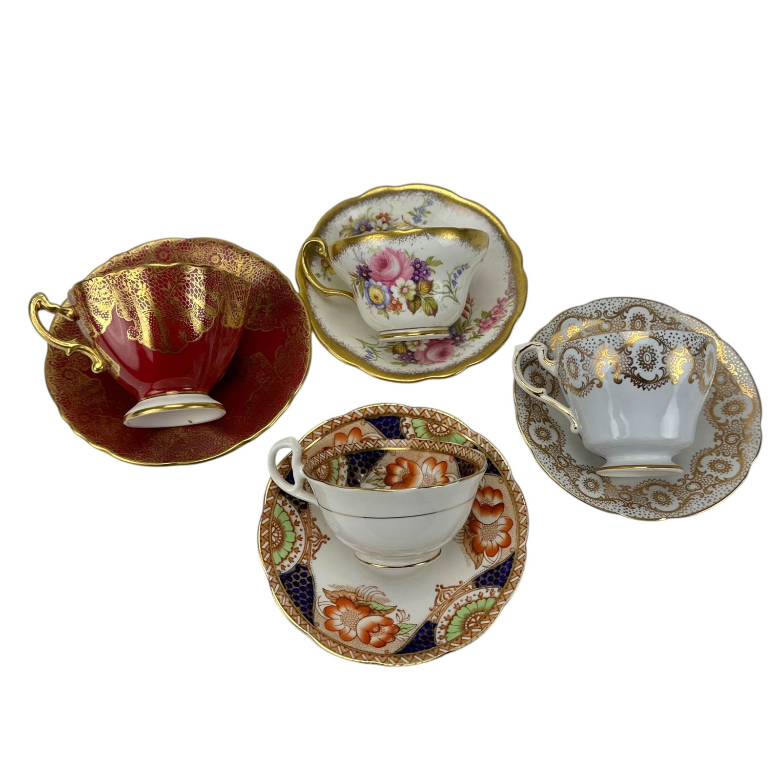 Foley Hammersley Bell China Paragon Cup Saucer LOT: Group of four English bone china teacup and saucer sets. Includes examples by Foley, Bell China, Paragon, and Hammersley. Each displays floral or fruit motifs with gilt bands over white, red, and patt