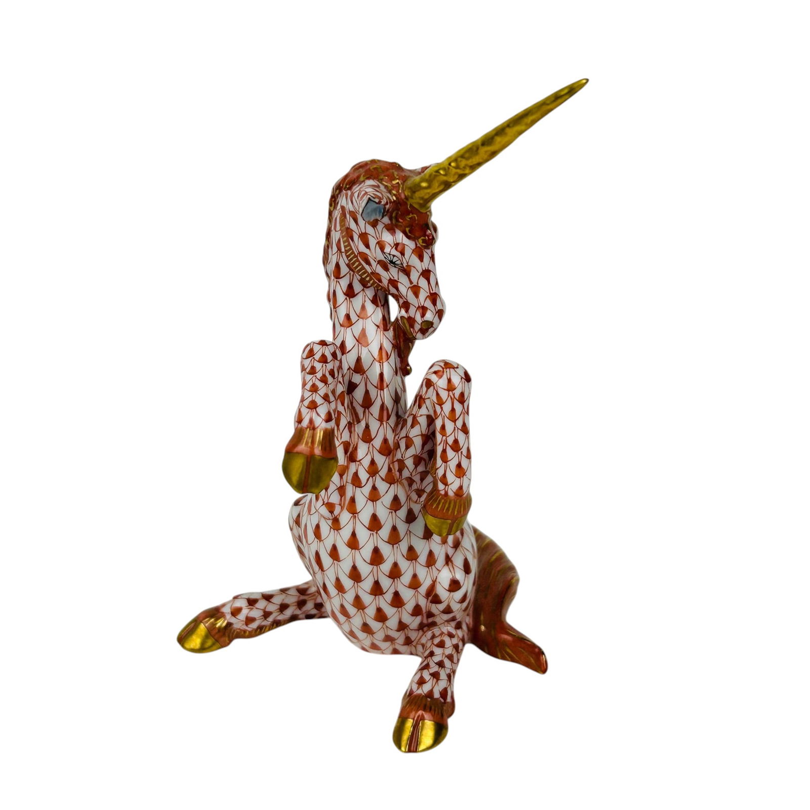 Herend Rust Fishnet Porcelain Unicorn Figurine: Herend Hungarian hand painted porcelain Unicorn figurine. The rearing mythical creature displays the signature Rust Fishnet scale pattern across the body with a flowing mane and tail accented in match