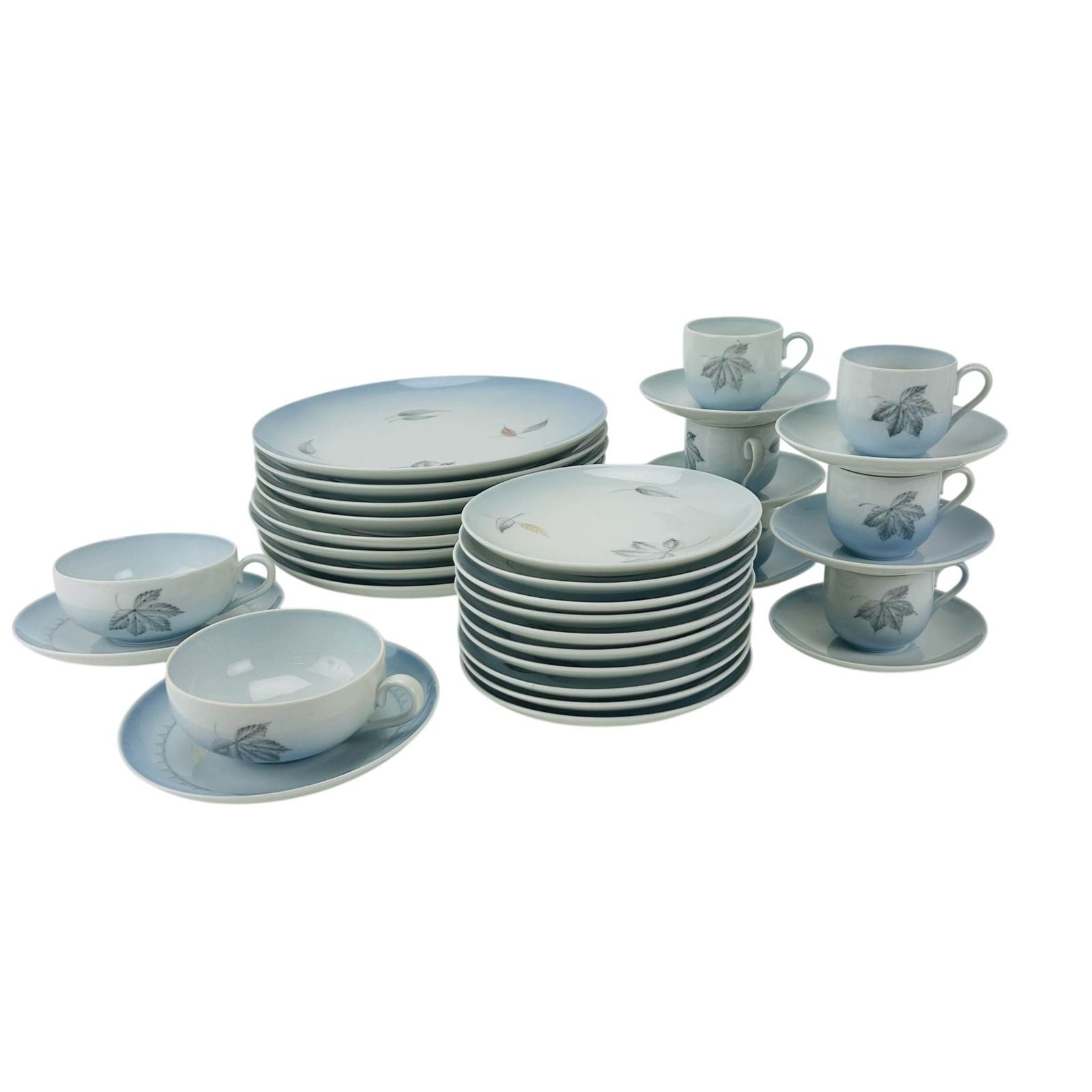 Bing & Grondahl Falling Leaves Partial Dinnerware: Bing and Grondahl (B&G) retired / discontinued Danish porcelain partial china dinnerware service in the Falling Leaves pattern. Design features a gradient pale blue ground decorated with delicate gray
