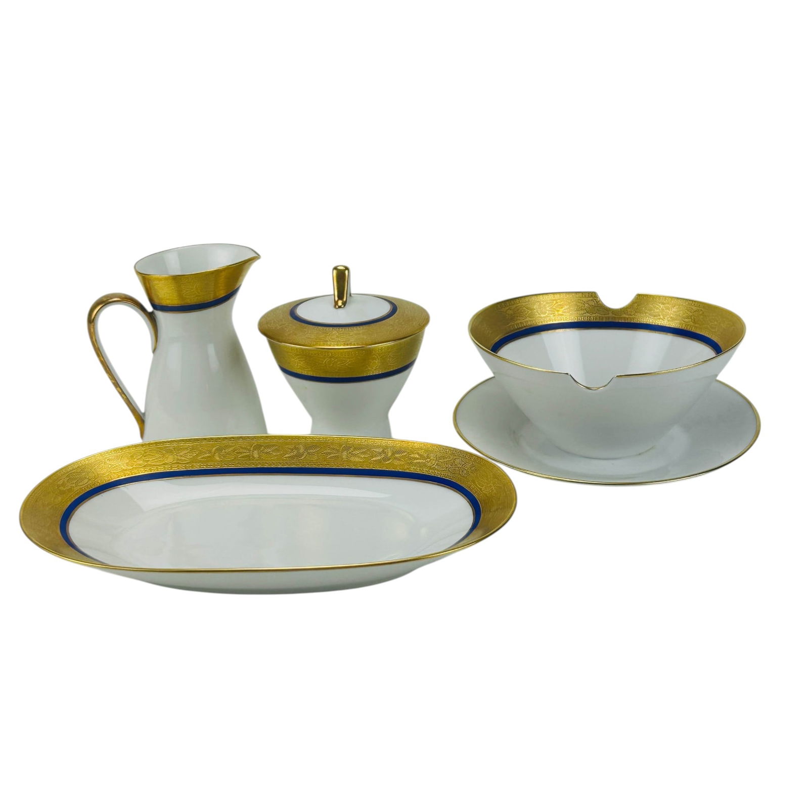 Rosenthal Gold & Cobalt Band Creamer Sugar Tray 4p: Rosenthal Germany porcelain milk creamer jug, lidded sugar pot bowl, oval tray and gravy sauce boat with attached underplate, total of four pieces. Each features a richly engraved gilt border accented