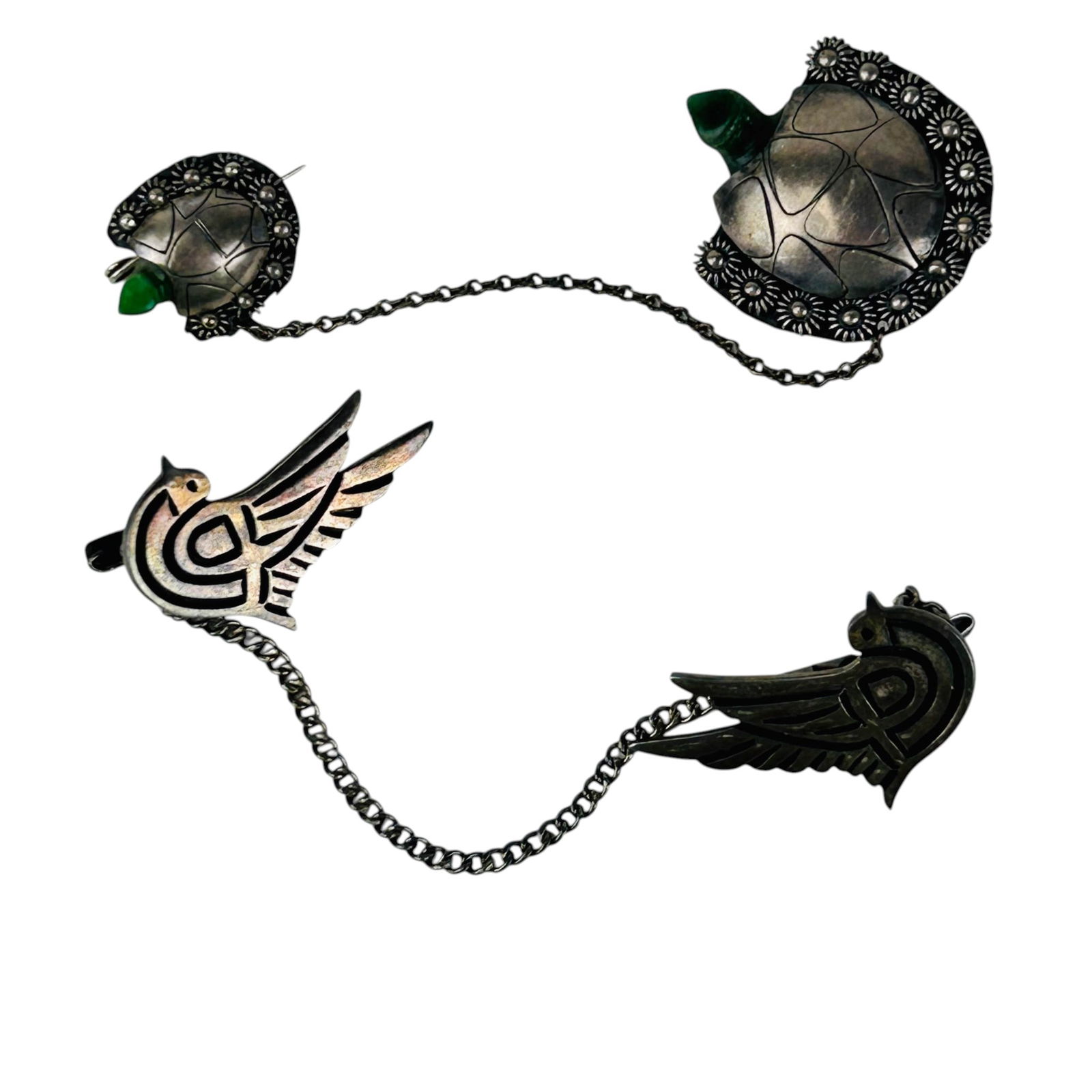 Mexico Sterling Bird Sweater Clip & Turtle Brooch: Grouping of two Mexican sterling silver 925 jewelry items. One example features stylized bird forms with geometric wing decoration joined by chain, reverse stamped A Munoz Sterling 925. The second exa