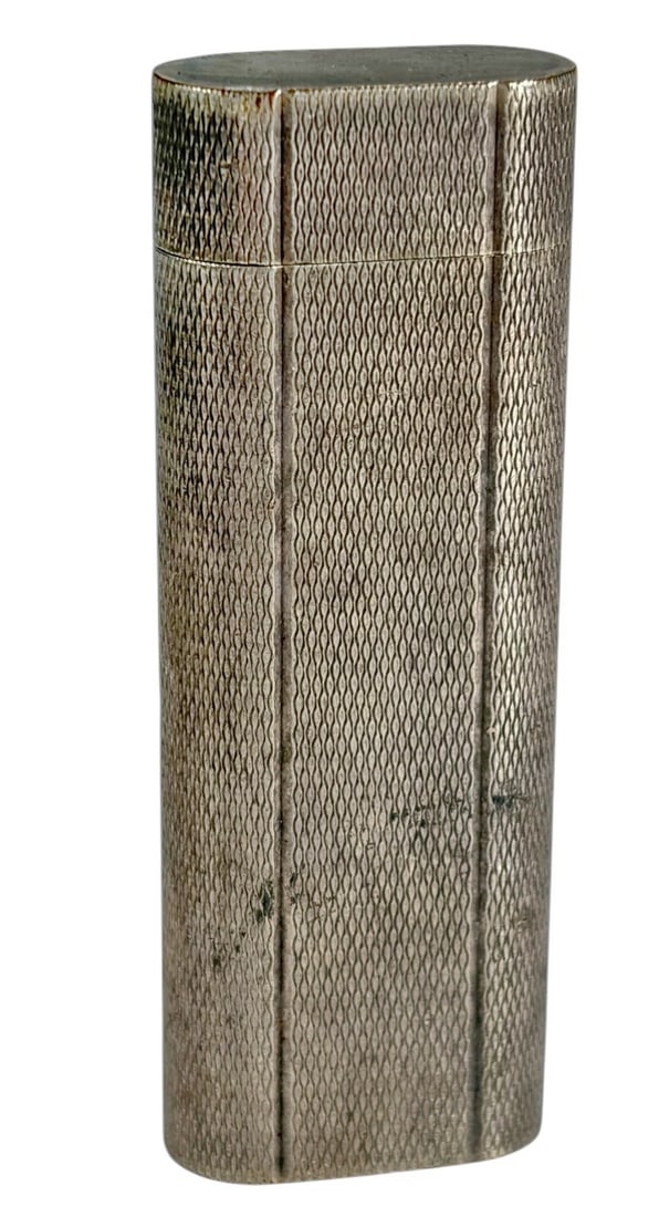 Cartier Paris Swiss Made Silver Plated Lighter: Cartier Paris silver plated lighter, Swiss made, tall rectangular form with textured pattern and rounded edges, classic luxury design, compact pocket size. Marked 'Cartier Paris' on its base.Dimension