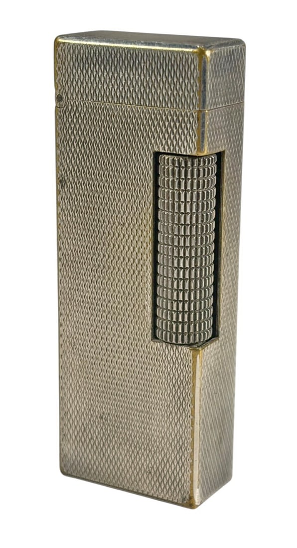 Dunhill Rollagas Swiss Made Silver Plated Lighter: Dunhill Rollagas lighter in silver plated finish, Swiss made, rectangular form with fine textured pattern and side roller ignition, classic luxury pocket lighter design. Marked 'Dunhill Made in Switze