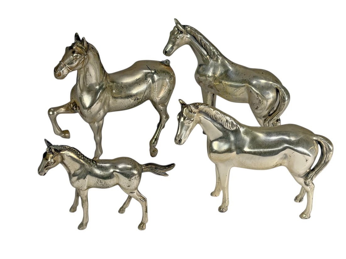 Philadelphia Mfg Co Silver Plated Horses 4pc LOT: Philadelphia Mfg Co, group of four silver plated horse figures including three adults and one foal in naturalistic poses with polished finish and detailed features. One example is marked 'Made in Japa