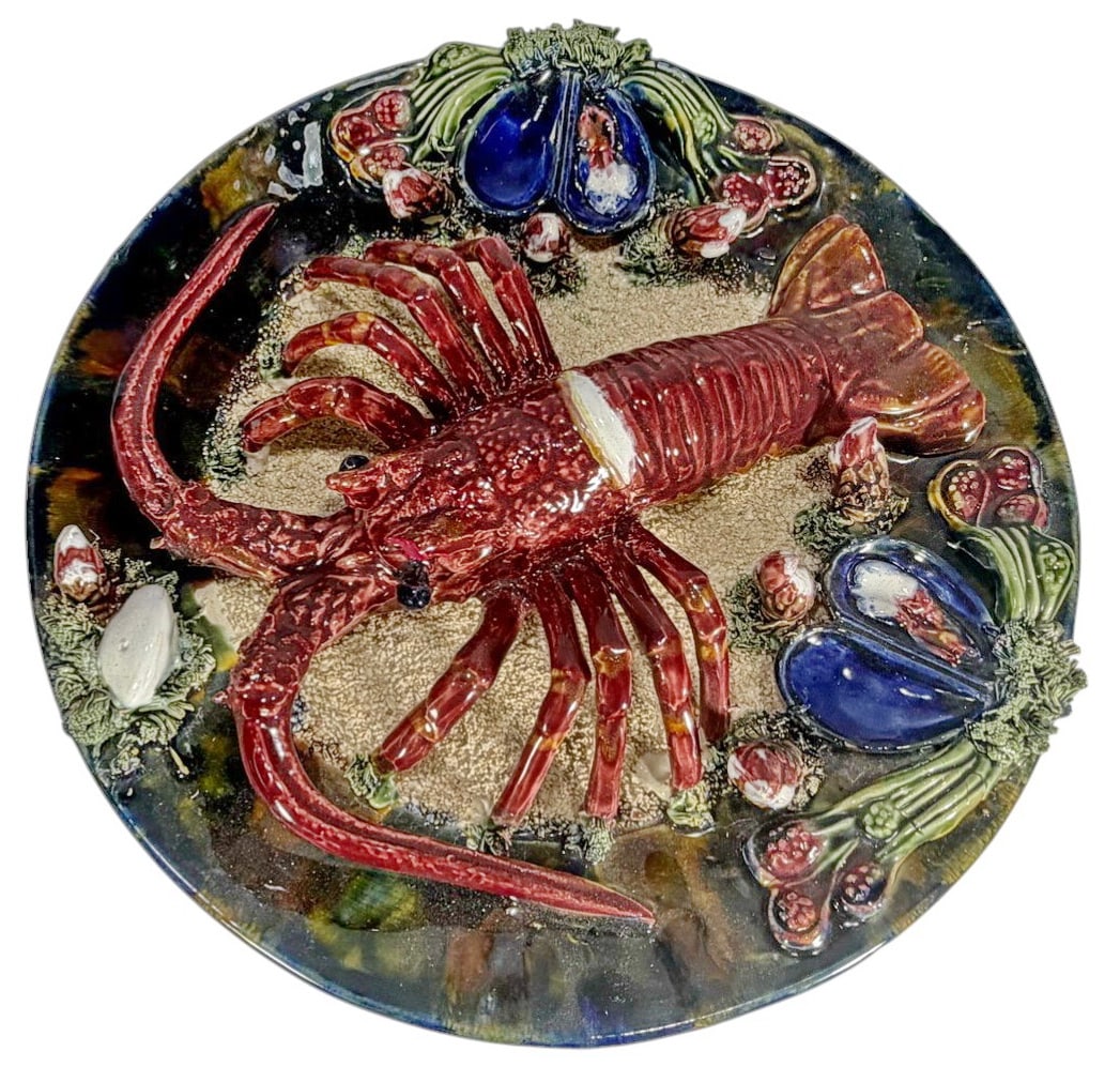 Olfaire Portugal by Alvaro Jose Majolica Platter: Olfaire Portugal by Alvaro Jose majolica lobster platter with sculptural red lobster in high relief on a textured seabed. Richly glazed in vibrant tones, marked to underside.Dimensions: 3.25 X 13 X 13