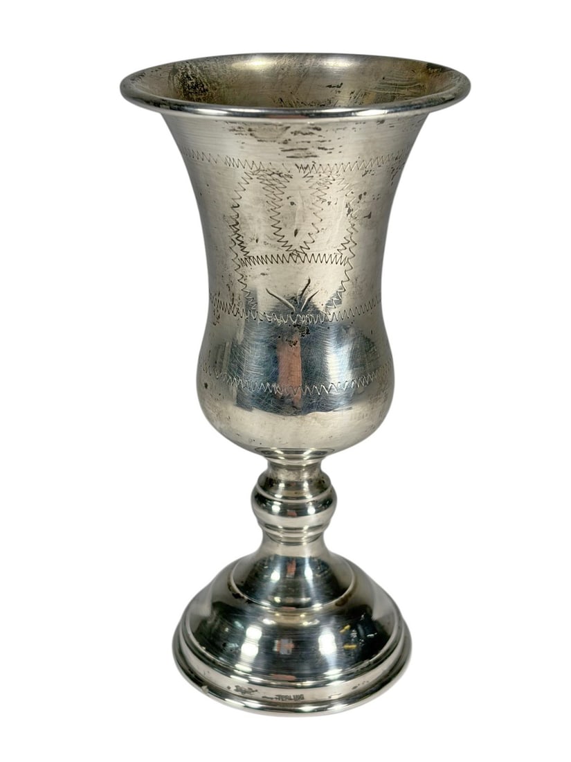 Antique Judaica Sterling Silver Kiddush Goblet: Judaica sterling silver Kiddush wine goblet with tall baluster form, flared rim, and stepped base, engraved with geometric banded motifs. Marked sterling to the base. Total weight approximately 42.8 g