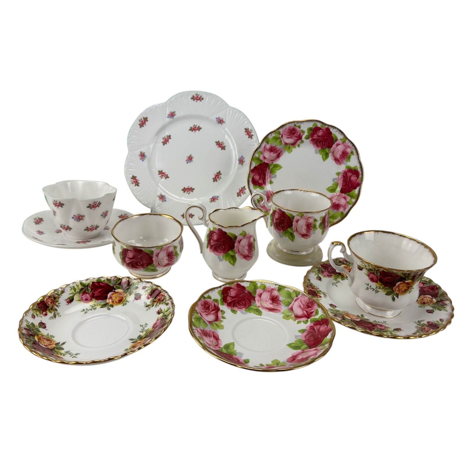 Royal Albert & Shelley England Tea Set Group LOT: Group of English bone china partial tea service pieces. Includes Royal Albert Old Country Roses teacup, saucer and bread butter. Royal Albert Old English Rose pattern tea cup, saucer, bread butter pla