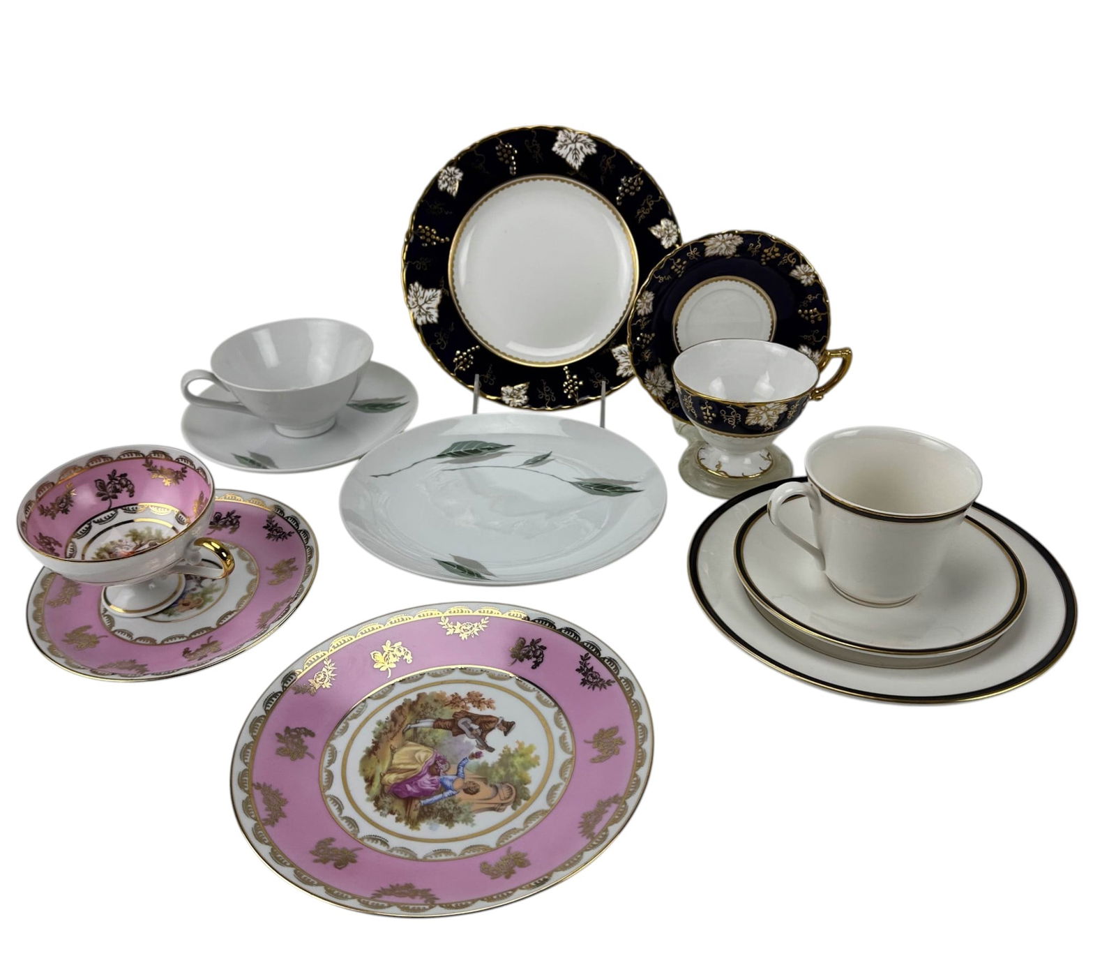 Royal Doulton Hutschenreuther Derby Trio China LOT: Group of bone china and porcelain teacup trios. Includes Royal Crown Derby Vine Cobalt Blue pattern with cobalt and gilt vine border, produced 1944-1977. Royal Doulton Oxford Black pattern cup with sa