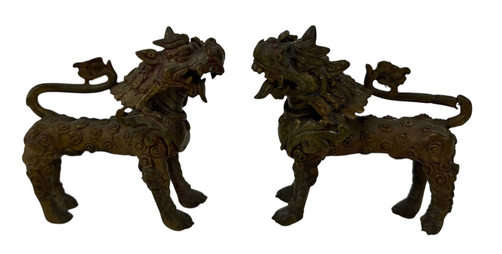 Chinese Pair Bronze Foo Dragon Lion Dog Sculptures: Pair of Chinese bronze figural temple guardian mythological ferocious lion figures in standing poses. Bodies display curled tail, open mouth, raised spine elements, and spiral scale likke surface moti
