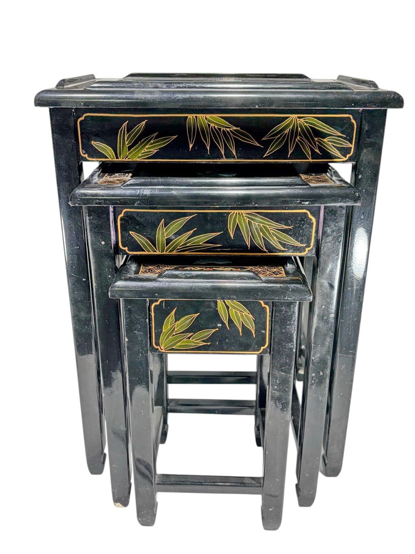 Chinese Black Lacquer MOP Inlaid Side Tables 3pcs: Chinese set of three black lacquer nesting tables, mother of pearl inlay with figures and landscape scenes, gilt and polychrome decoration, bamboo motif details, glass inset tops. The largest measures