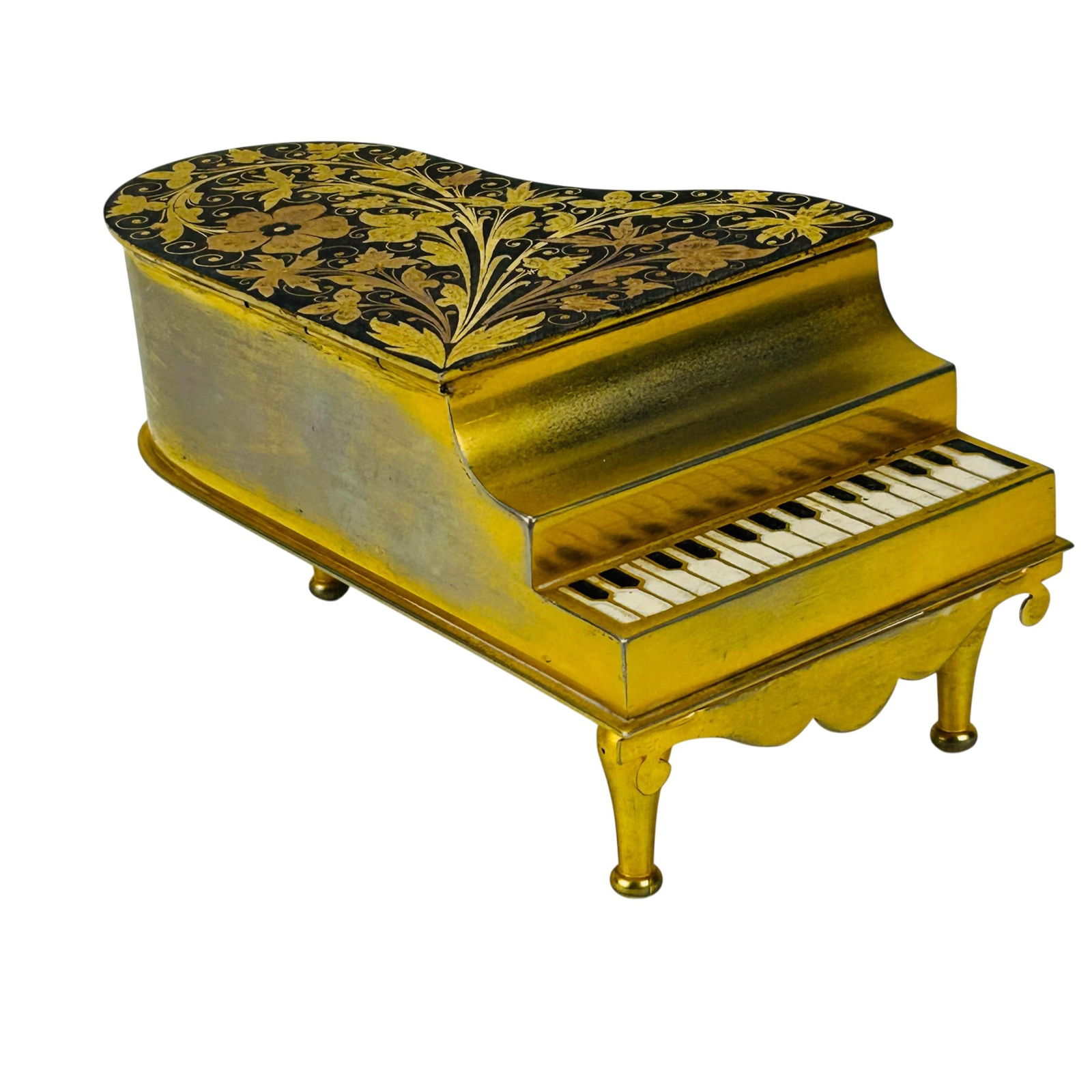 Spanish Toledo Damascene Mini Piano Musical Box: Spanish Toledo Damascene metal grand mini piano music box with hinged lid and raised keyboard detail. Top displays floral inlay pattern with scrolling vine motifs across a dark ground. Interior fitted