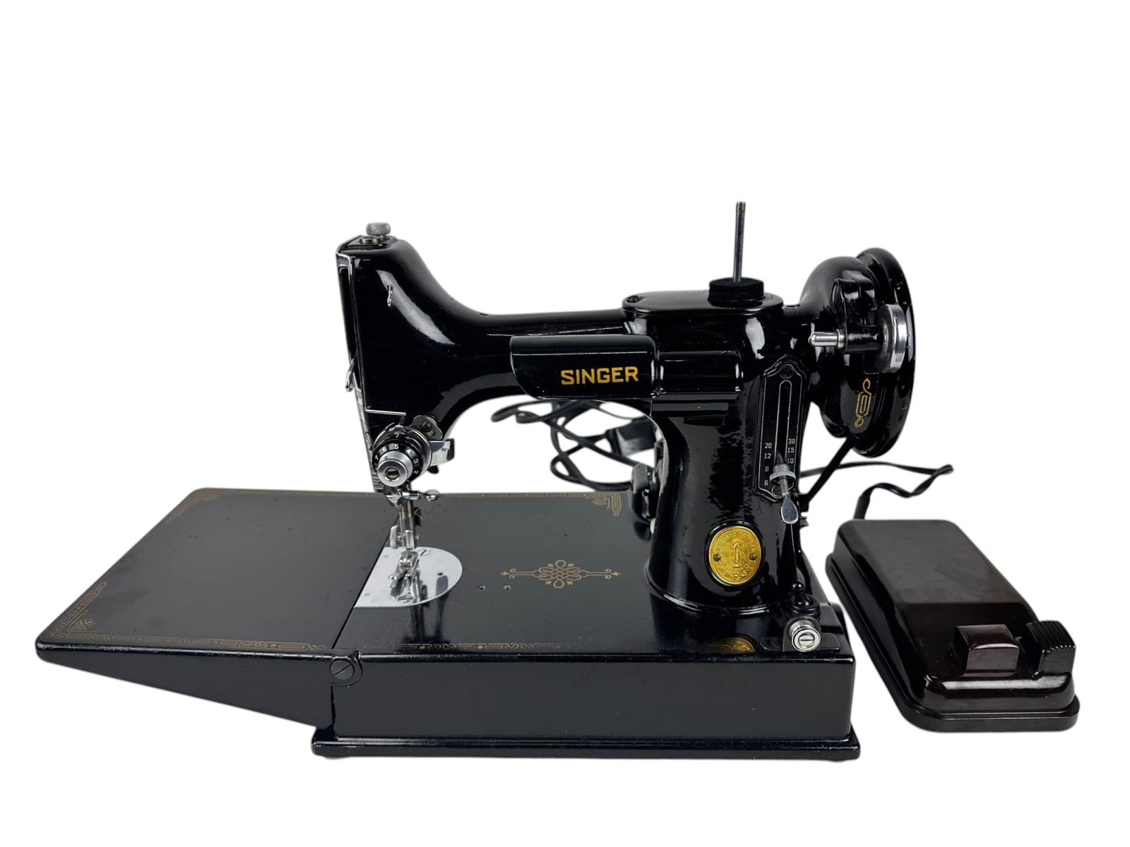 Singer Featherweight Sewing Machine # 221 w/ More: Singer Featherweight model 221 sewing machine with serial number AH195002 in portable carry case with foot pedal, cord, attachments, bobbins, thread, needles, and instruction booklet. Black body with