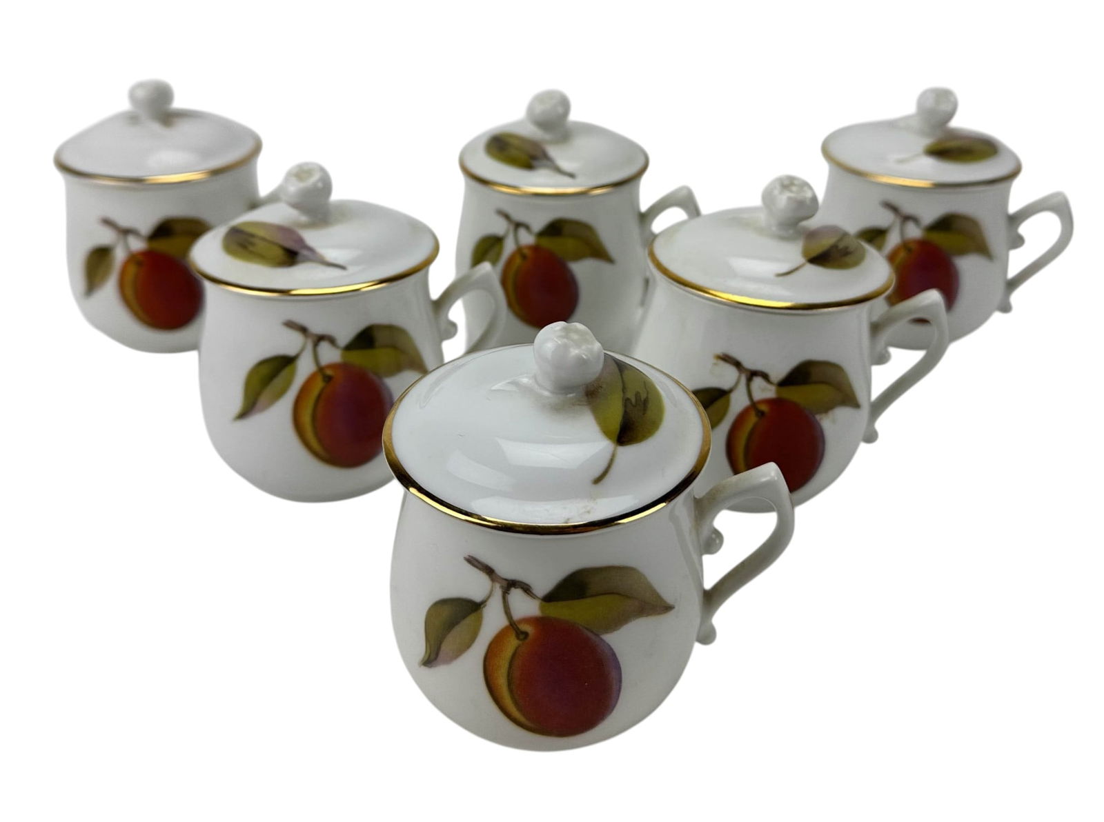 Royal Worcester Porcelain Evesham Pot De Creme 6pc: Royal Worcester English porcelain lidded pot de creme (pot of custard) modeled in the in the Evesham pattern (1961-2015). Set of six. Form with handle and removable cover. Decorated with fruit motifs