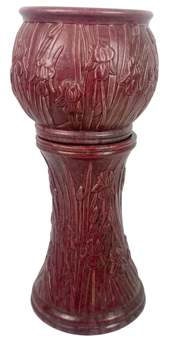 Vintage Burgundy Pottery Jardiniere & Pedestal Set: Vintage burgundy pottery jardiniere and pedestal set, featuring a raised iris flower and leaf motif in a rich matte glaze. The matching pieces are beautifully detailed, with the irises wrapping around