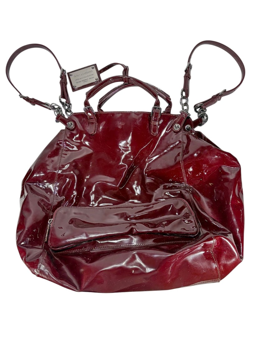 Dolce & Gabbana Style Vernis Burgundy Glam Handbag: Dolce & Gabbana style women's handbag in burgundy patent leather with slouchy form, dual handles, and detachable strap. Silver-tone hardware, leopard-print lining, and interior zip pocket with logo ta