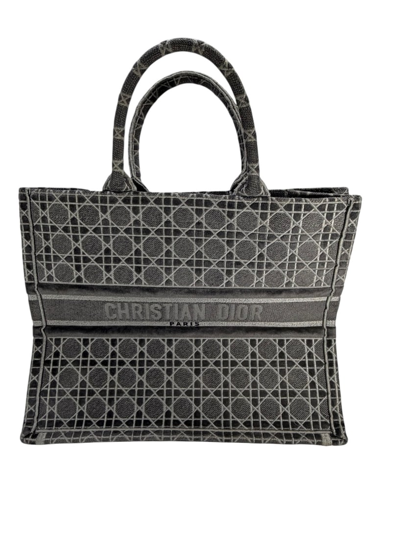 C. Dior Style Book Tote Gray Denim Oblique Handbag: Christian Dior, a Book Tote style handbag crafted in gray oblique patterned denim canvas featuring the iconic geometric motif throughout. The structured rectangular form includes dual rolled top handl