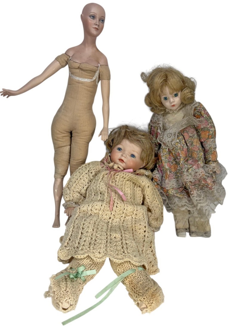 Ron Booker & Muller & Loffler German Dolls 3pc LOT: Group of 3 bisque dolls including Muller & Loffler, Ron Booker style and others, featuring glass eyes, painted and carved details, and dressed in decorative and hand-knit clothing, including art and c
