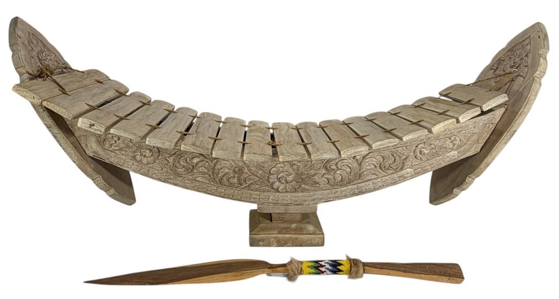 Indonesian Wood Instrument & African Spear 2pc LOT: Two-piece ethnographic lot including carved Indonesian wooden xylophone-style instrument with decorative motifs and African-style spear with carved shaft and beaded handle. The largest measures approx