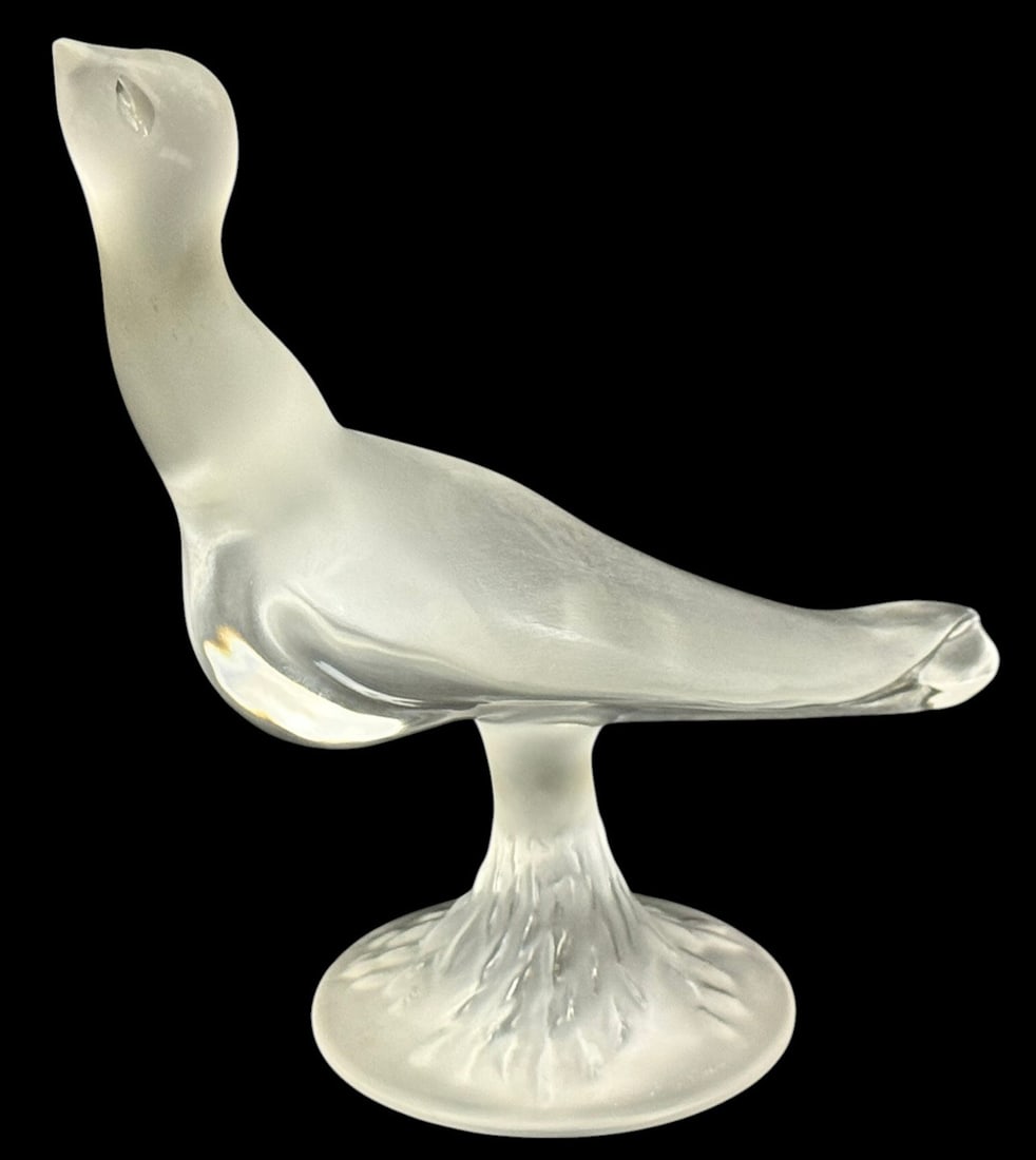 Lalique French Crystal Daphnis Seagull Figure 8" H: Lalique, modeled Daphnis seagull figurine in frosted French crystal. The sculpture depicts a stylized seabird with elegantly elongated neck and streamlined body, perched atop a circular pedestal base