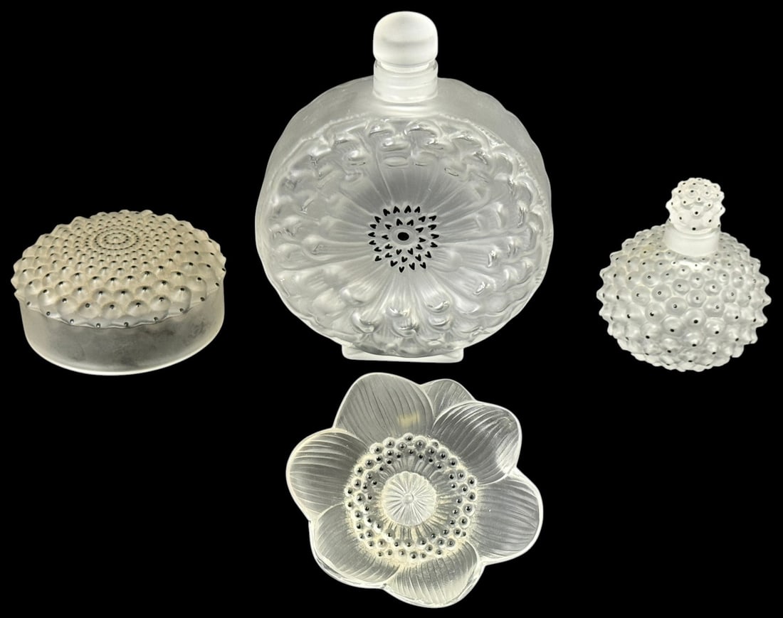 Lalique French Crystal "Anemone" Decor 4pc LOT: Lot of four Lalique frosted crystal dresser items in the Anemone pattern. The lot includes two perfume bottles with matching stoppers, a circular powder jar cover, and a small floral form dish or pape