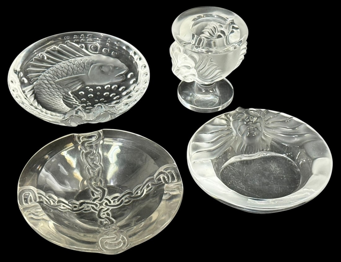 Lalique French Crystal Art Glass Items 4pc LOT: Lot of four Lalique French crystal table and smoking accessories including the Concarneau pattern dish featuring a molded fish surrounded by bubbles, a circular ashtray with interlocking chain link mo