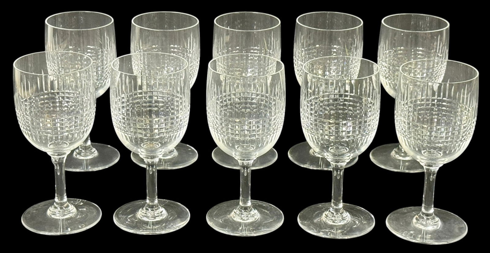 Baccarat "Nancy" Crystal Stemware Glasses 10pc SET: Baccarat set of ten Nancy pattern crystal stemware glasses featuring the iconic crosshatch and vertical cut design to the bowl with clear stems and circular bases. Every glass retains its acid-etched