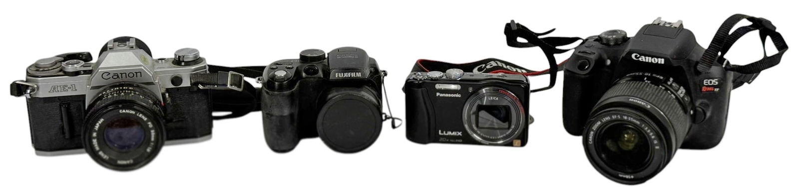 Canon Fujifilm Panasonic AE1 Mixed Camera 4pc LOT: Lot of four Canon, Fujifilm, and Panasonic cameras including both film and digital examples. The group features a Canon AE-1 35mm film camera fitted with a Canon FD 50mm lens, a Canon EOS Rebel T7 dig