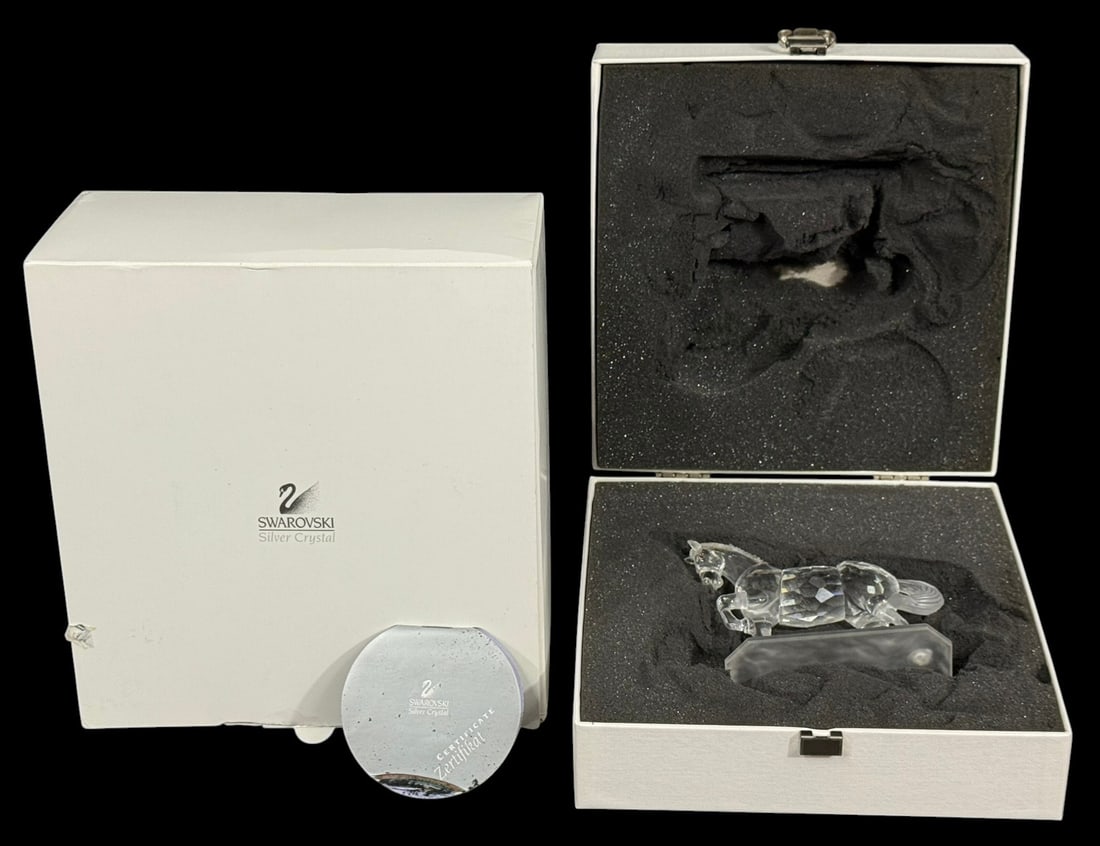 Swarovski Crystal Arabian Stallion Figurine w/ Box: Swarovski crystal figurine depicting an Arabian stallion, finely faceted to capture light with brilliant clarity and detail. The horse is shown in a graceful prancing pose atop a frosted base. Bears i