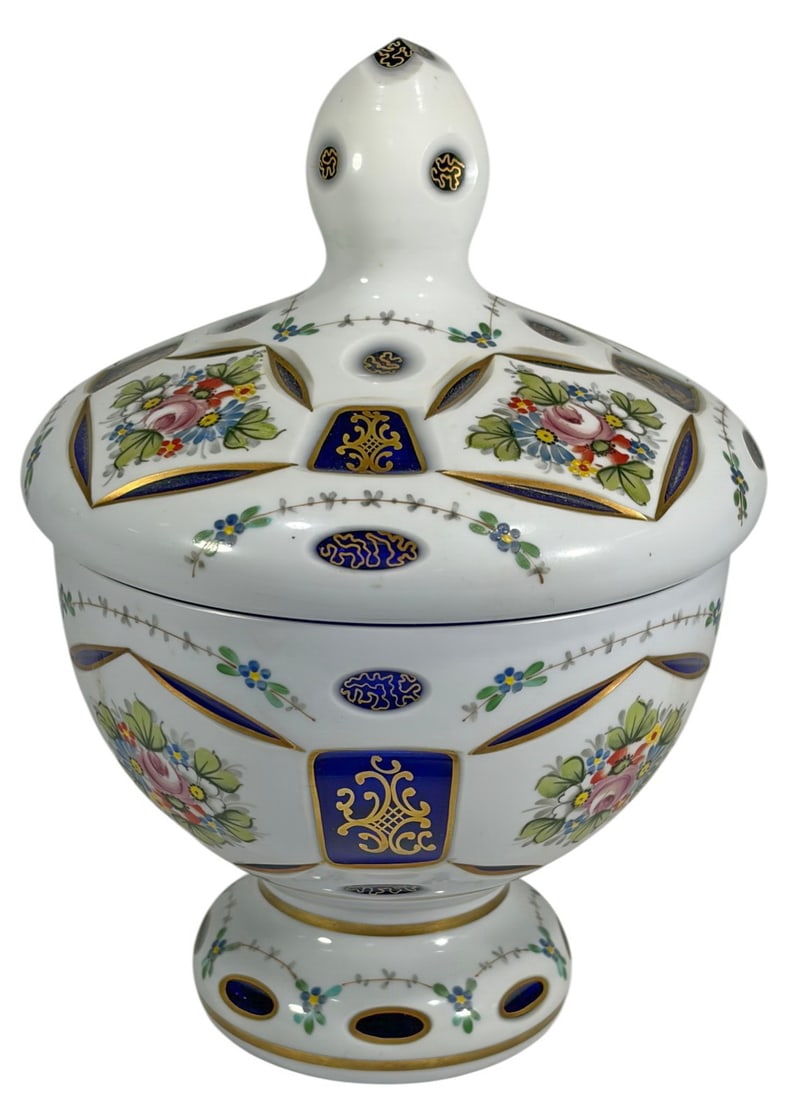 Bohemian Czech Overlay Cut to Cobalt Glass Jar: Bohemia Glass white overlay cut to cobalt covered jar, floral enamel decoration with gilt accents, alternating blue and white panels, interior cobalt, retains original Bohemia label.Dimensions: 8.75 X