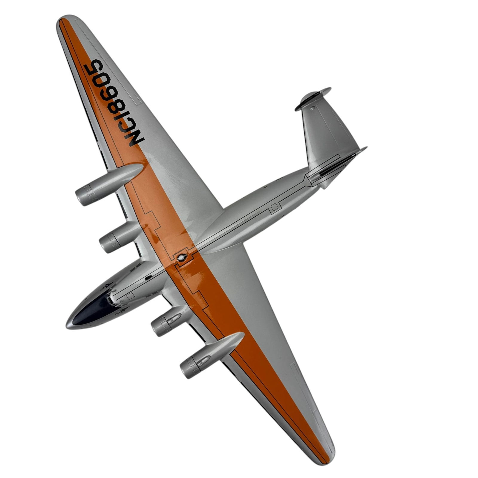 Pan Am Dixie Clipper NC18605 Desk Model Airplane: Model toy airplane marked PAA Pan American Airways Boeing 314 model Dixie Clipper designation and registration NC18605. Four engine design with silver tone body, orange wing band, and printed insignia
