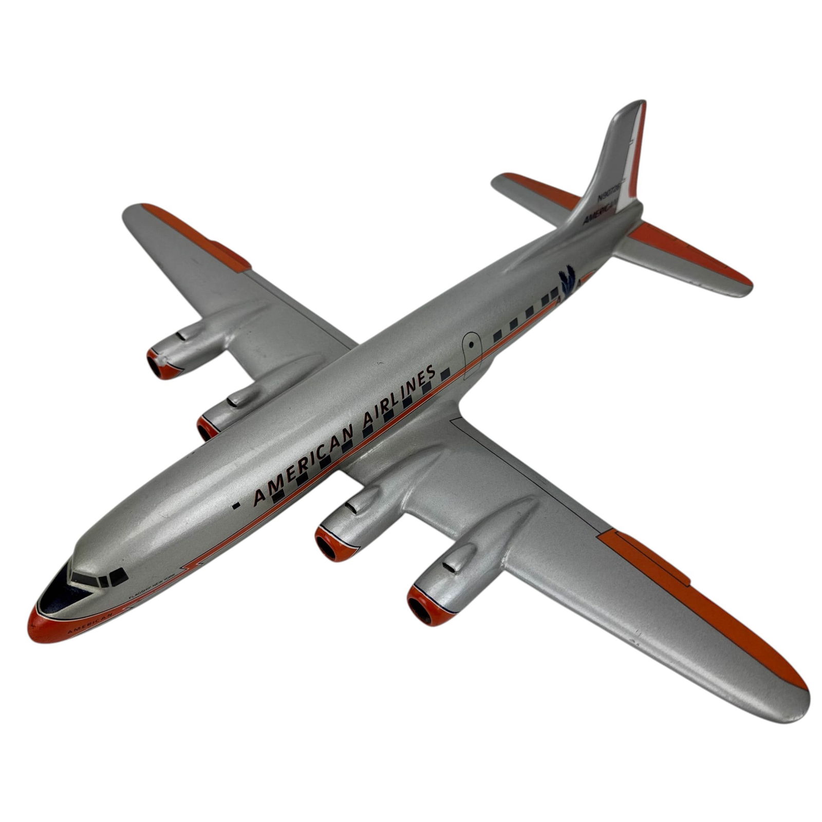 American Airlines 4 Engine Model Airplane N90726: Model aviation aircraft in American Airlines livery with silver body, orange accents, and marked N90726. Features four engines, fuselage windows, and AA eagle insignia. Constructed as a display model