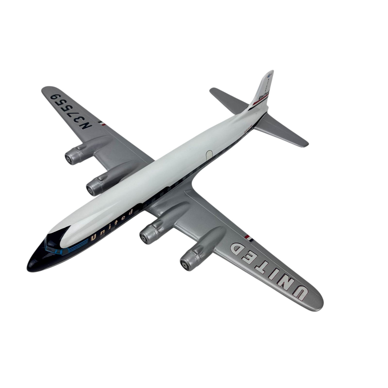 United Airlines DC-6B Desk Model Airplane N37559: Model aviation aircraft in United Airlines livery marked DC-6B Mainliner with registration N37559. Features four engines, silver tone wings, white fuselage, and blue nose section with window details.