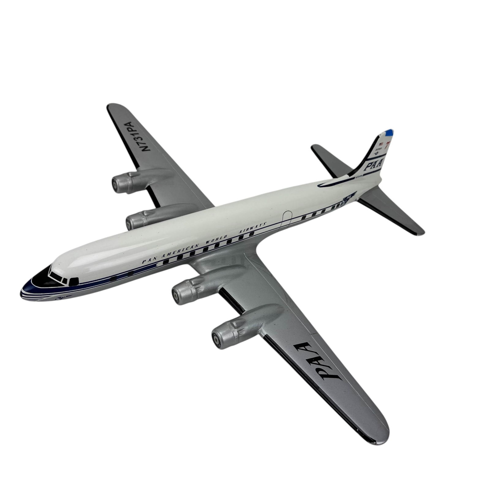 Pan Am Electra Desk Model 4 Engine Airplane N731PA: Model aviation aircraft in Pan American World Airways livery marked Pan American World Airways with registration N731PA. Four engine configuration with silver wings and white fuselage. Displays PAA lo