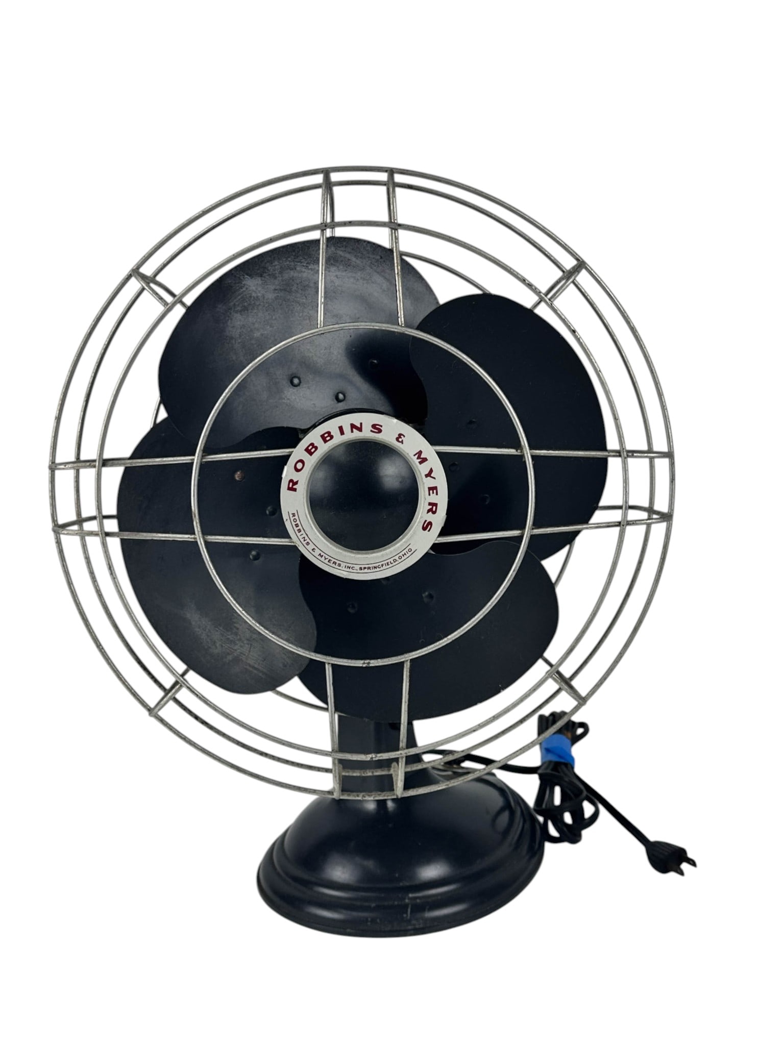 Robbins & Myers Art Deco 4 Blade Desk Electric Fan: Robbins and Myers Art Deco electric desk fan featuring a four blade configuration with black painted metal blades and wire cage. Retains its Robbins and Myers badge marked Springfield Ohio, with a mot