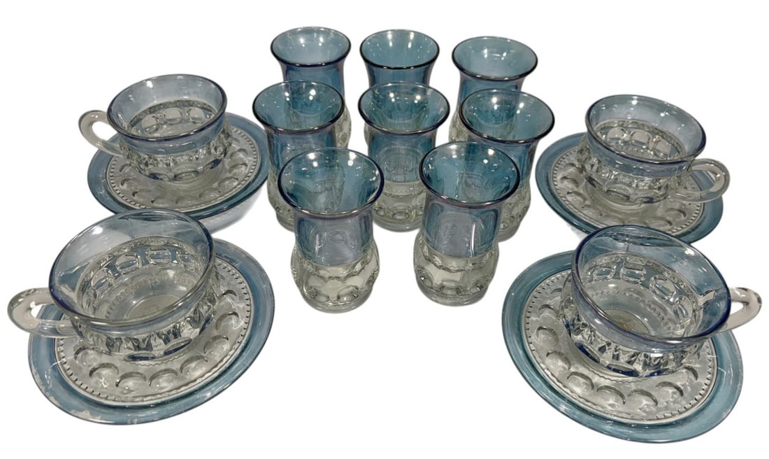 Tiffin-Franciscan Kings Crown Blue Glass Set 19pcs: Tiffin Franciscan Kings Crown pressed glass set, nineteen pieces in blue and clear glass, includes cups with saucers and tumblers, thumbprint crown motif with flared rims, mid century design. The larg