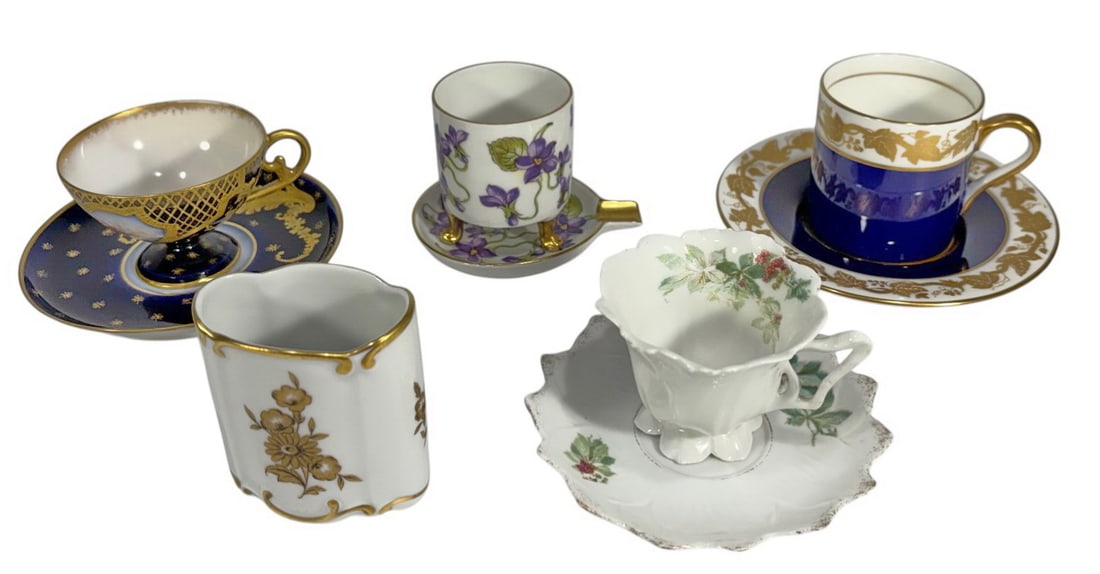 Sevres, Wedgwood, Jlmenau, Bavaria Cups 9pc LOT: Sevres, Wedgwood, Jlmenau, and Bavaria group of nine porcelain cups and saucers, including cobalt and gilt decorated examples, floral motifs, and figural scenes. Various forms and styles, with maker's