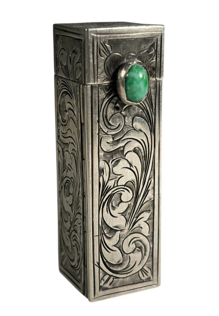 Italian 800 Silver & Stone Engraved Lipstick: Italian 800 silver engraved lipstick case featuring ornate foliate decoration an a green cabochon stone. Marked 800 for silver fineness. Dimensions: 2.25 X 0.5 X 0.5 in. Condition: Good overall co